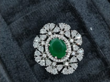 emerald statement ring, oval emerald and diamond ring, pear cut cluster jewelry, green stone cocktail ring, luxury floral ring, large gemstone ring, dramatic cluster ring, vintage style emerald ring, bespoke jewelry design, high-end fine jewelry