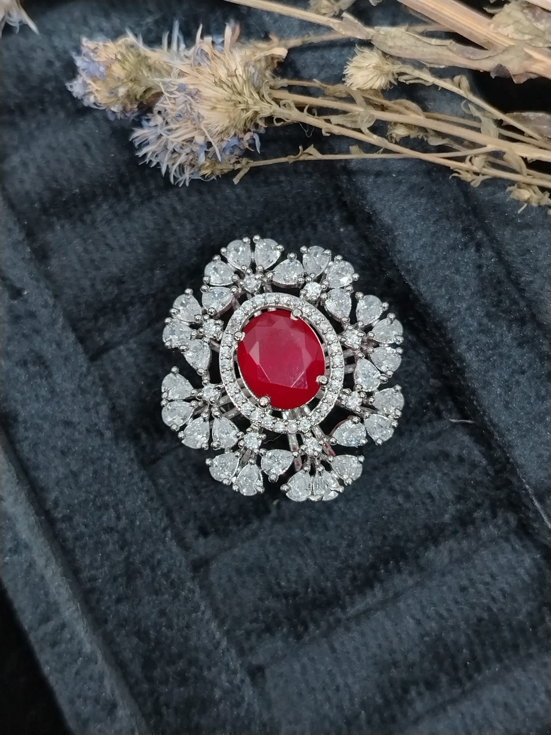 ruby statement ring, oval ruby and diamond ring, pear cut cluster jewelry, red stone cocktail ring, luxury floral ring, large gemstone ring, dramatic cluster ring, vintage style ruby ring, high-end fashion jewelry, bespoke ruby design